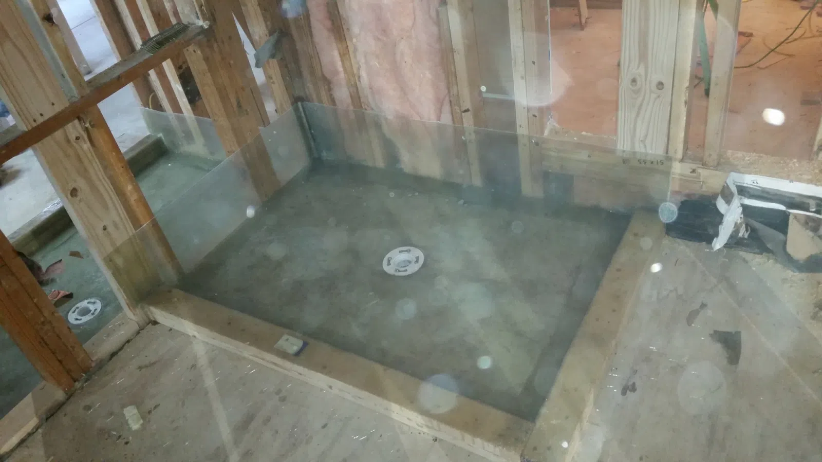 Fiberglass shower pan installation by Lamberth Waterproof Systems